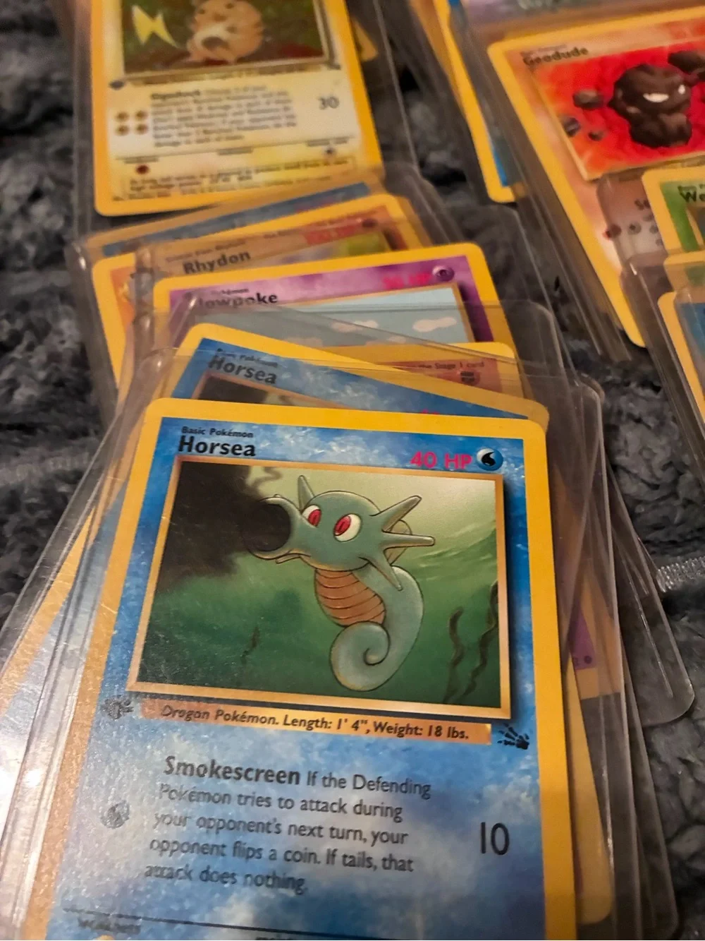 Pokemon Trading Card Lot - Assorted Colors 1997-98 trading cards in plastic hold